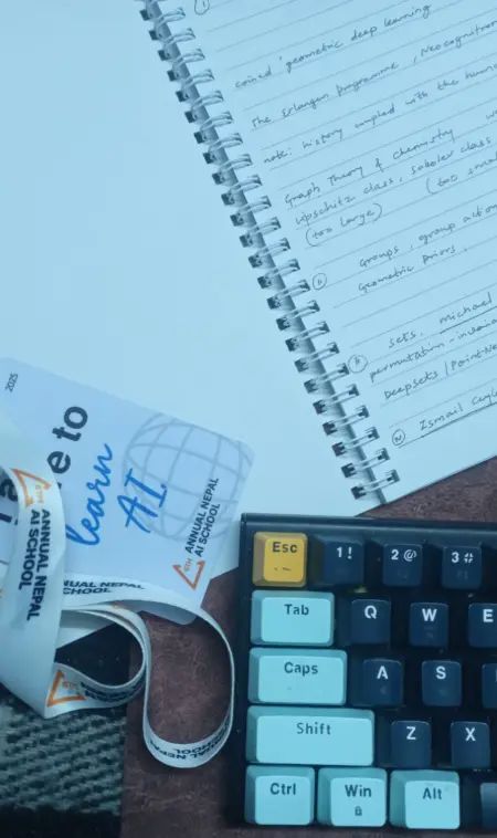 The event card, a notebook, and my keyboard