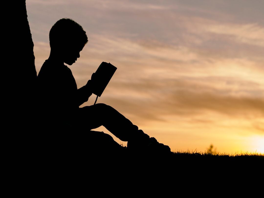 a kid reading a book