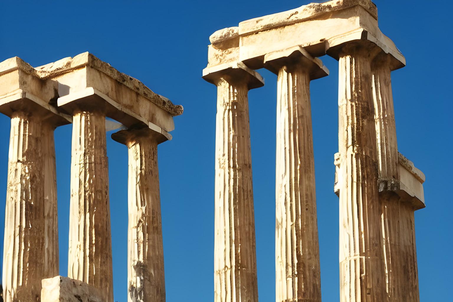 4 greek pillars surrounding a really small building