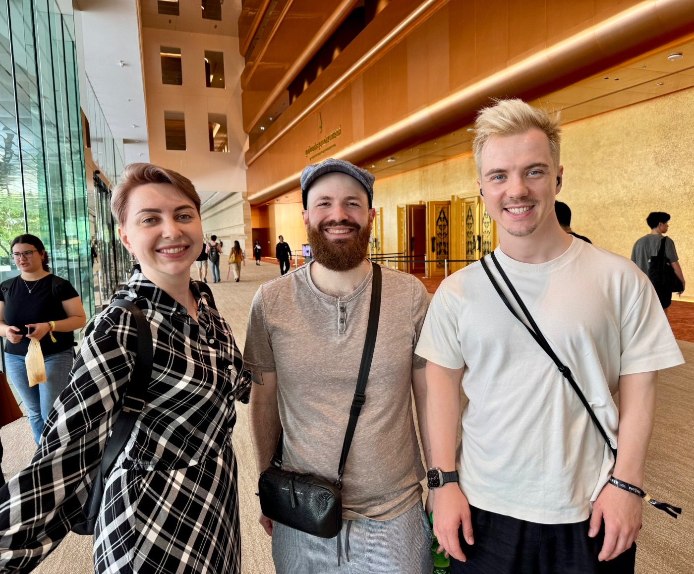 Me, sassal.eth, and my husband Andrii at the Devcon venue, Day 0