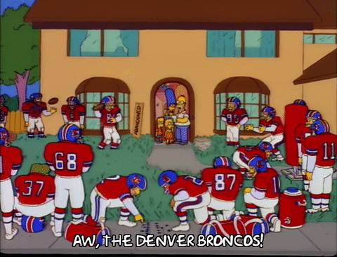 Homer looking at a football team on his front yard saying