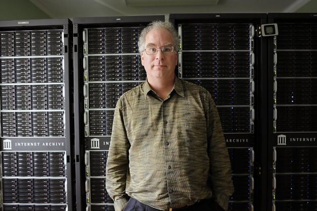 Brewster Kahle, founder of Internet Archive (with the PetaBox behind him)