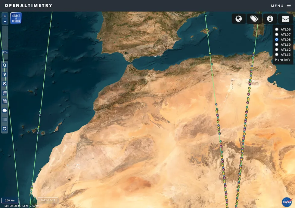 Image from OpenAltimetry showing a true-color image of North Africa and the Strait of Gibraltar. Green lines indicate the ICESat-2 orbit; colored dots indicate available data, in this case the ATL08 product is selected, which is Level 3 Land/Water Vegetation Elevation. Credit: OpenAltimetry.