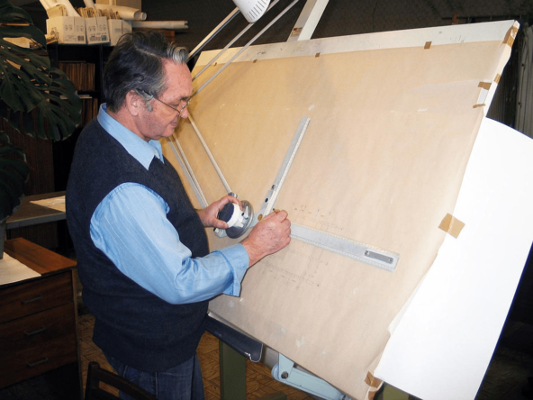 Engineer, drawing board, and drawings
