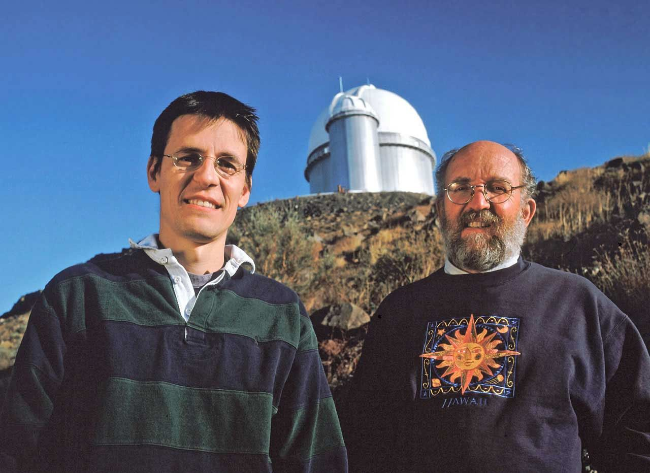 Swiss astronomers Didier Queloz and Michel Mayor in front of the La Silla Observatory in Chile