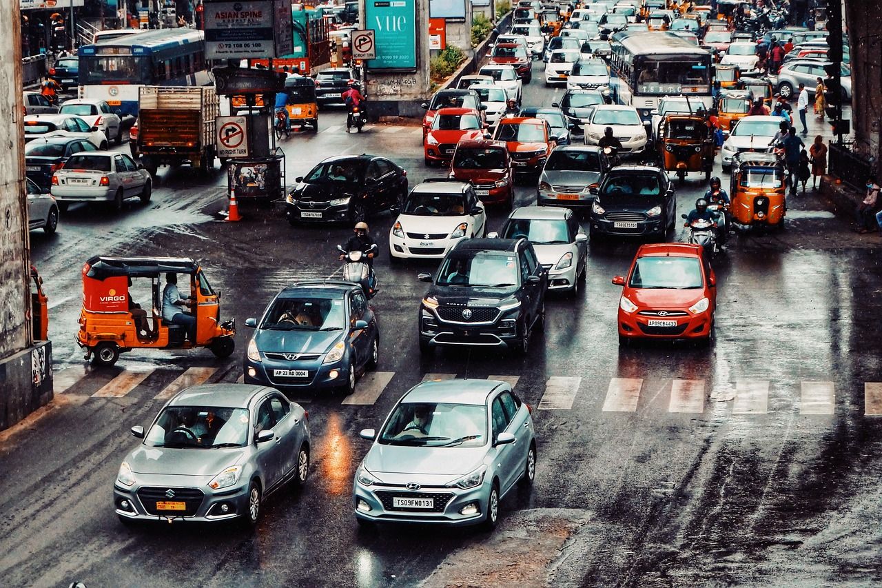 Fair Auctions, Automata Routing, and Rebalancing for Distributed Mobility‑On‑Demand Assignment